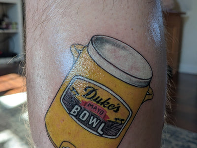 DUKE’S MAYONNAISE BATH DUMPER GETS MAYO BOWL TATTOO TO COMMEMORATE MAYO BATH